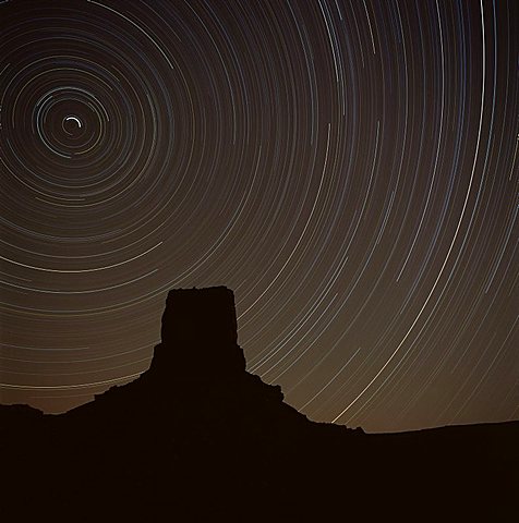 Star tracing over Monument Valley, tracing stars moving round the North Star, Monument Valley, an area in Utah and Arizona, United States of America (U.S.A.), North America